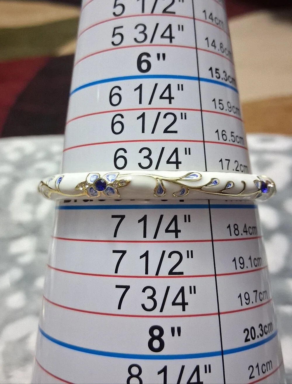 Elegant White Enamel Bangle Bracelet with Blue Floral Accents